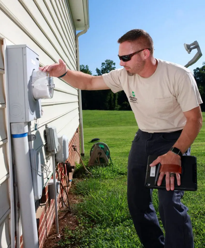 Man checks meter outside