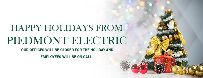 Happy holidays from Piedmont Electric. Our offices will be closed for the holiday and employees will be on call. Image of a Christmas tree.