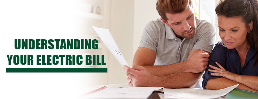 Understanding your electric bill. Image of two people looking at bills.